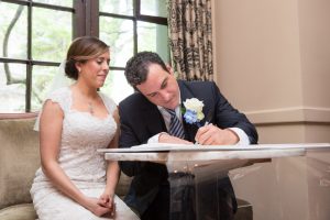 Bride groom sign ketubah, Chicago Wedding