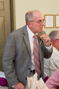 Father making toast to bride