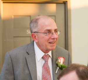 Father making toast to bride